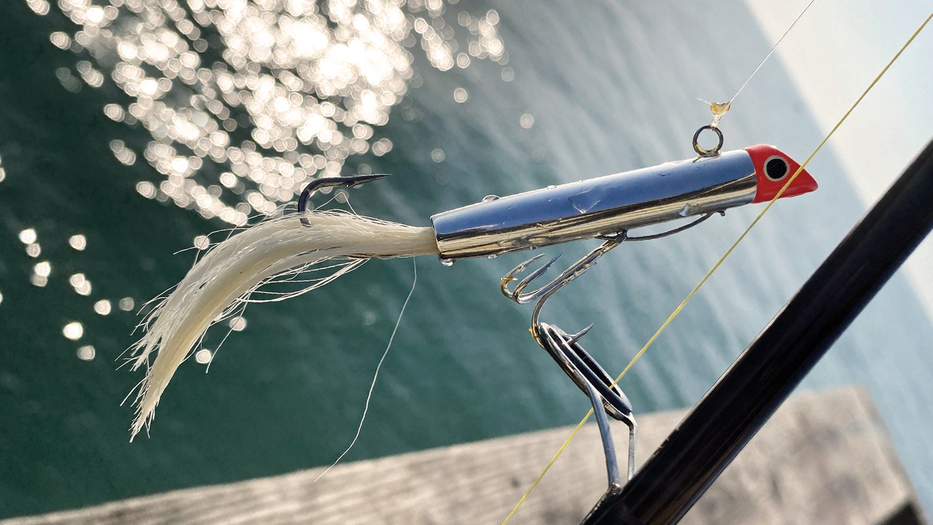 Got-cha lure with bucktail and water background